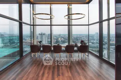 Luxurious high-rise dining area with panoramic city views and elegant lighting.
