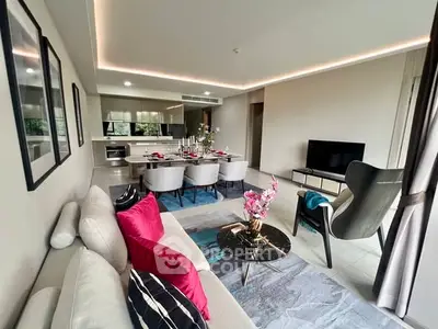 Modern living room with elegant decor and open kitchen layout