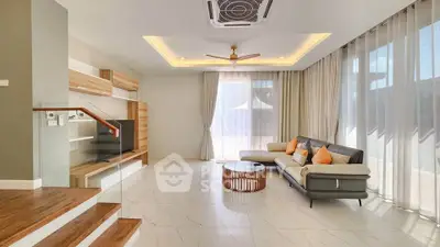 Spacious modern living room with elegant decor and natural light