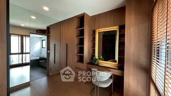Luxurious bedroom with wooden accents and elegant vanity area