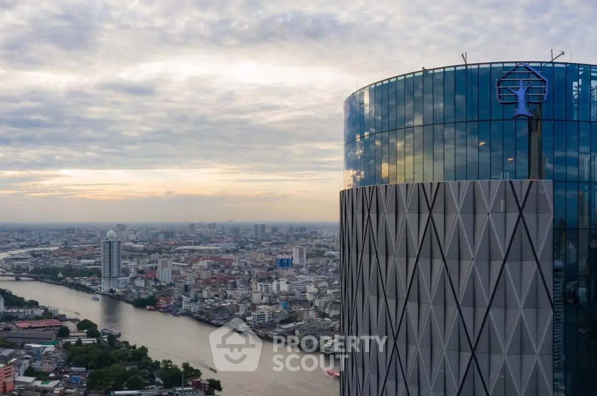 Stunning cityscape view from a modern high-rise building with river and skyline panorama.