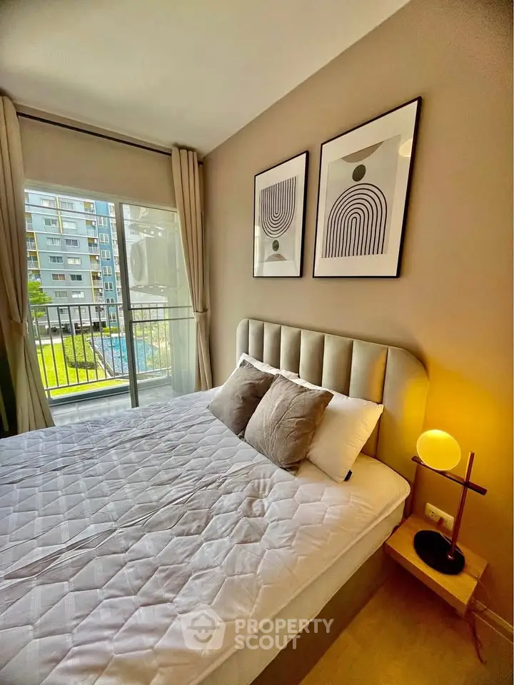 Modern bedroom with balcony view in stylish apartment