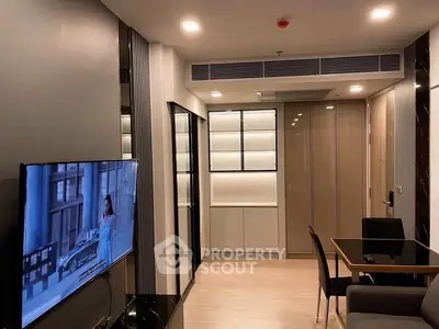 Modern living room with sleek design, featuring a wall-mounted TV and stylish dining area.
