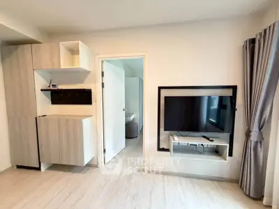 Modern living room with sleek TV setup and stylish storage solutions