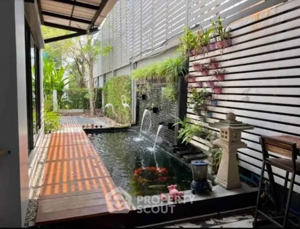 Stunning garden view with a serene koi pond and lush greenery, perfect for relaxation and tranquility.