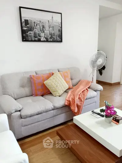 Cozy living room with stylish decor and comfortable seating, perfect for relaxation and entertaining.