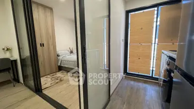 Modern apartment interior with sliding glass doors and natural light