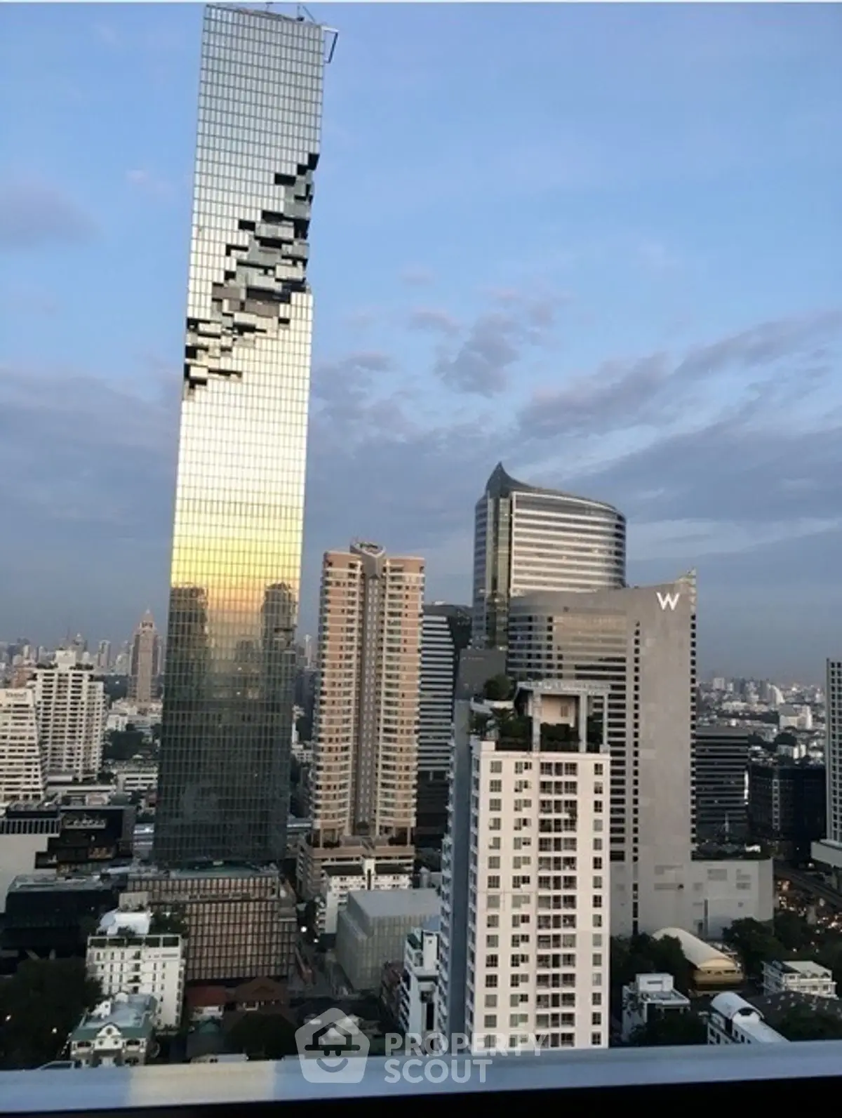 Stunning cityscape view featuring iconic skyscraper with unique architectural design.