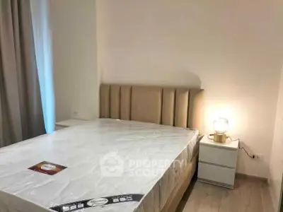 Modern bedroom with stylish bed and ambient lighting, perfect for a cozy retreat.