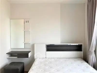 Modern minimalist bedroom with sleek furniture and natural light
