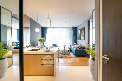 Luxurious open-plan living room with modern kitchen and elegant decor