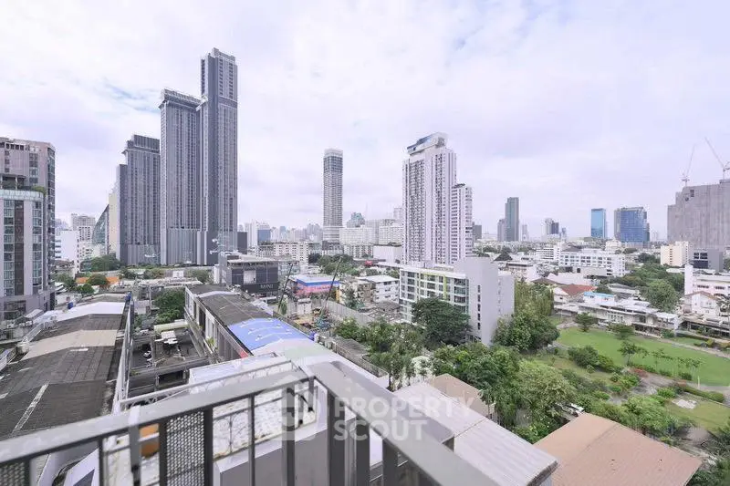 Stunning cityscape view from a high-rise balcony in a modern urban area.