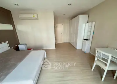 Spacious modern bedroom with minimalist design and ample storage space