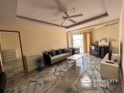 Spacious living room with marble flooring and modern furniture in a bright apartment