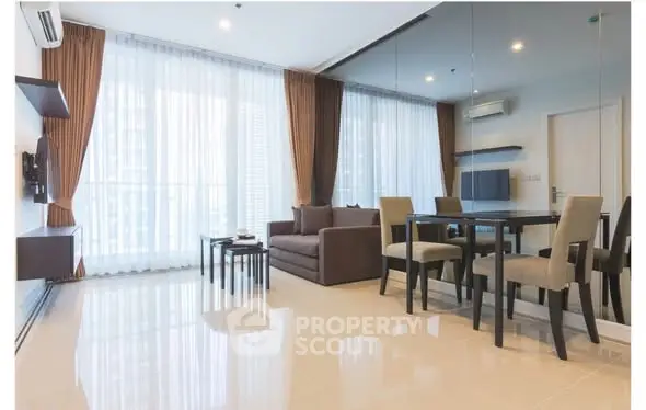 Spacious modern living room with large windows and elegant dining area in luxury apartment.