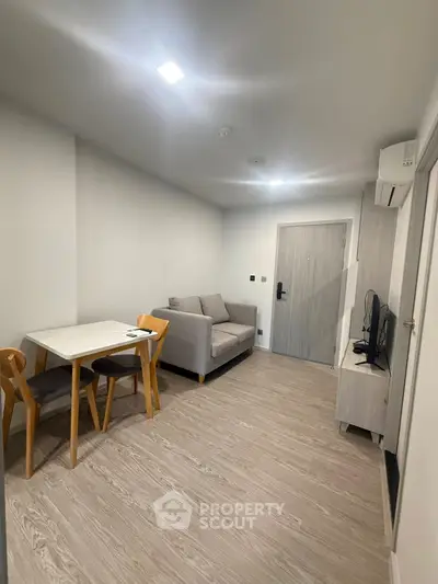 Modern living room with cozy sofa and dining area in stylish apartment