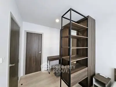 Modern minimalist study room with sleek shelving and wooden desk