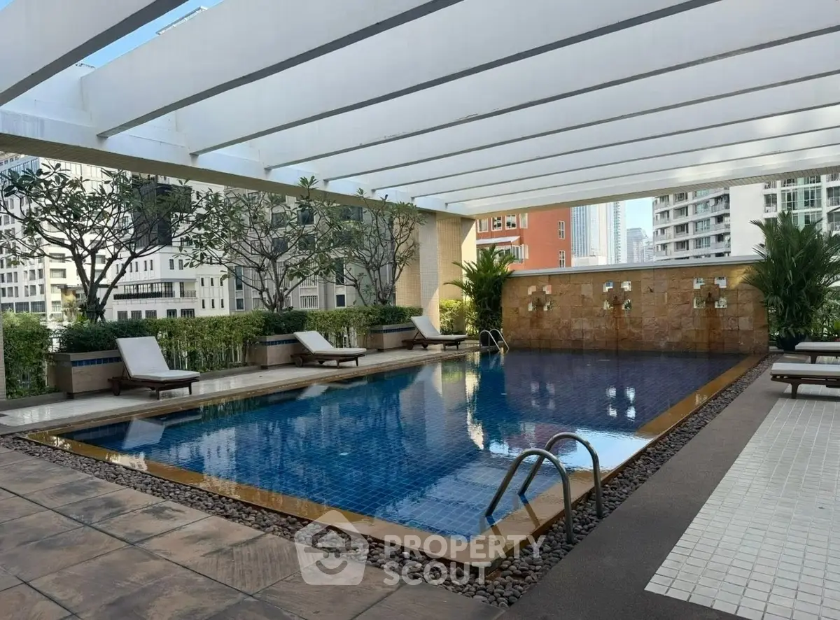 Luxurious rooftop pool with city views and modern design, perfect for relaxation and leisure.