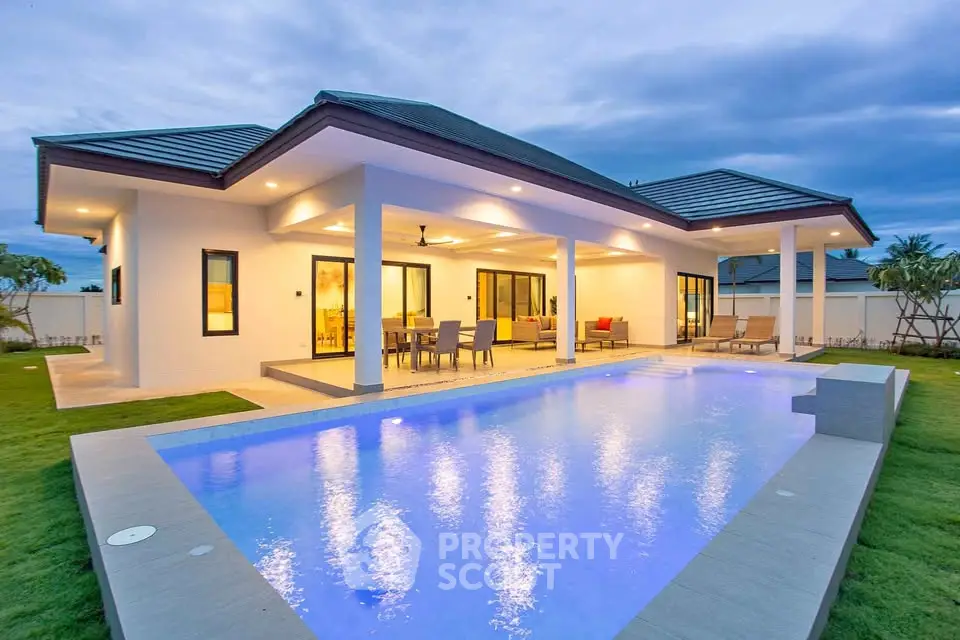 Luxurious modern home with stunning pool and spacious outdoor living area, perfect for entertaining.