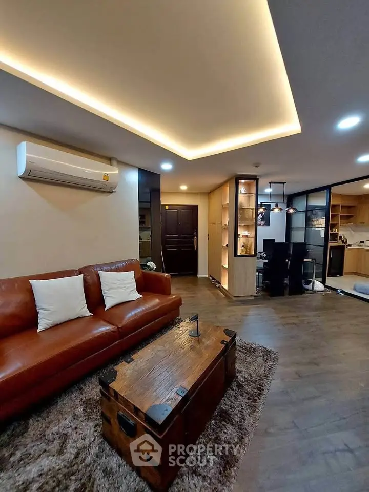 Stylish living room with leather sofa and modern lighting