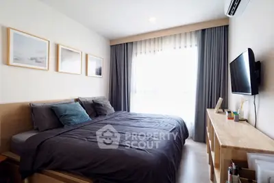 Modern bedroom with stylish decor and natural light