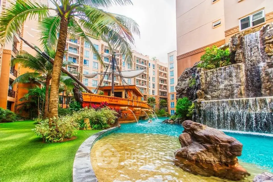 Luxurious apartment complex with unique pirate ship pool and waterfall feature.