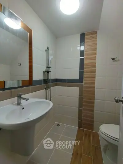 Modern bathroom with sleek fixtures and stylish tile design