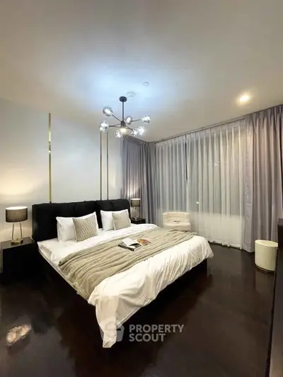 Luxurious bedroom with elegant decor and ambient lighting, featuring a king-sized bed and stylish curtains.