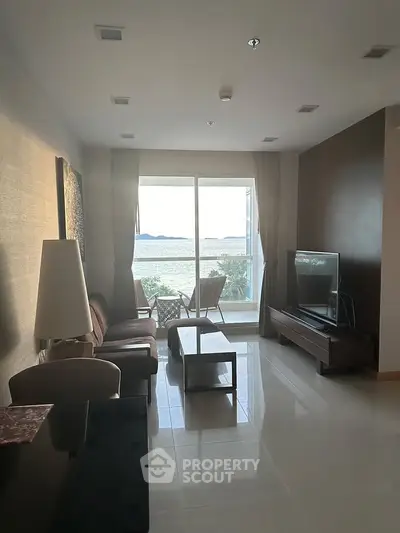 Spacious living room with stunning sea view and modern furnishings