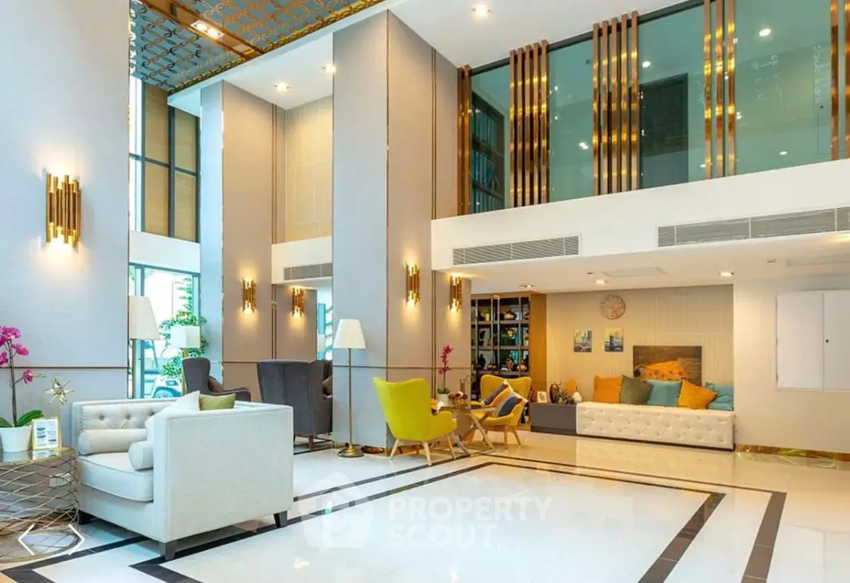 Luxurious modern living room with high ceilings and elegant decor in a spacious apartment.