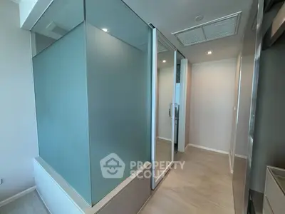 Modern bathroom with frosted glass shower and sleek design