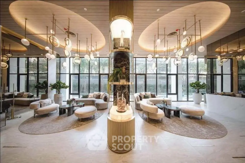 Luxurious modern lobby with elegant lighting and stylish seating, perfect for upscale living.