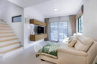 Modern living room with cozy sofa and stylish decor