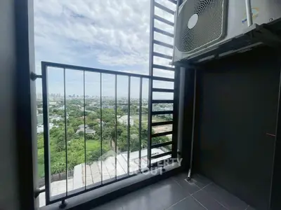 Stunning balcony view with city skyline and lush greenery, perfect for relaxation and enjoying the outdoors.