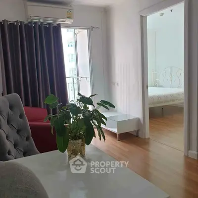 Charming apartment interior with cozy living area and bright bedroom view.