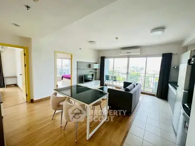 Spacious modern living room with open layout and balcony view