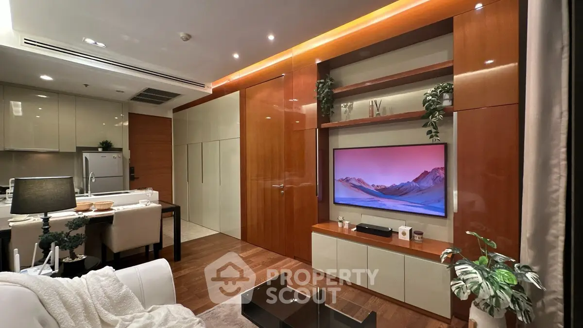 Luxurious modern living room with open kitchen, sleek wooden paneling, and elegant decor for a sophisticated lifestyle.