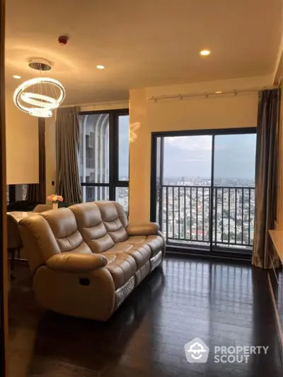 Luxurious living room with stunning city view and modern leather sofa.