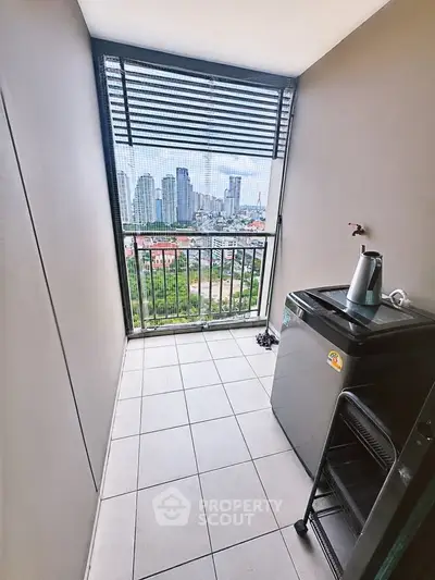 Modern balcony with city view and washing machine, perfect for urban living.