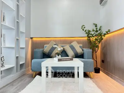Modern living room with stylish decor and cozy seating area, perfect for relaxation and entertainment.