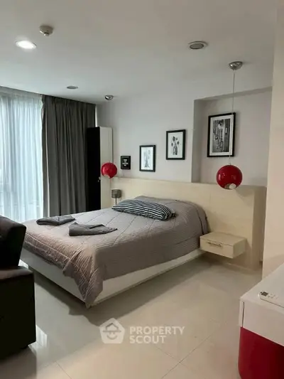 Modern bedroom with stylish decor and natural light