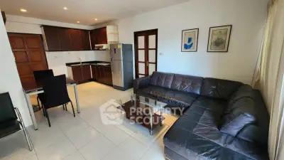 Spacious open-layout living room with modern kitchen and stylish furniture