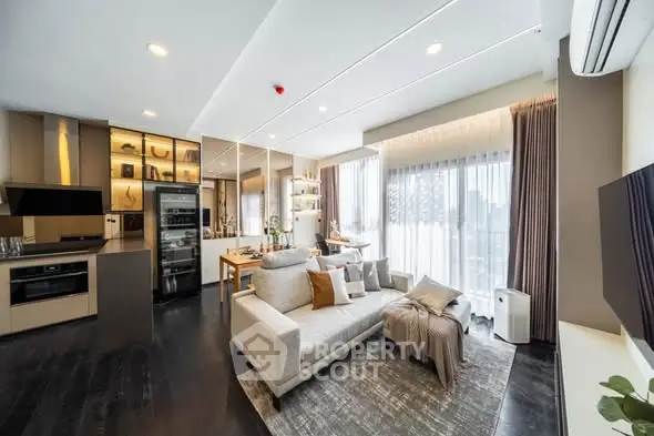 Modern open-plan living room with sleek kitchen and large windows