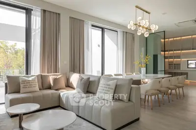 Luxurious modern living room with elegant dining area and large windows