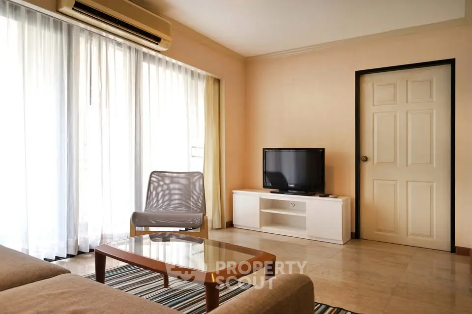 Spacious living room with modern furniture and natural light