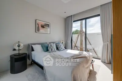 Modern bedroom with large window and stylish decor