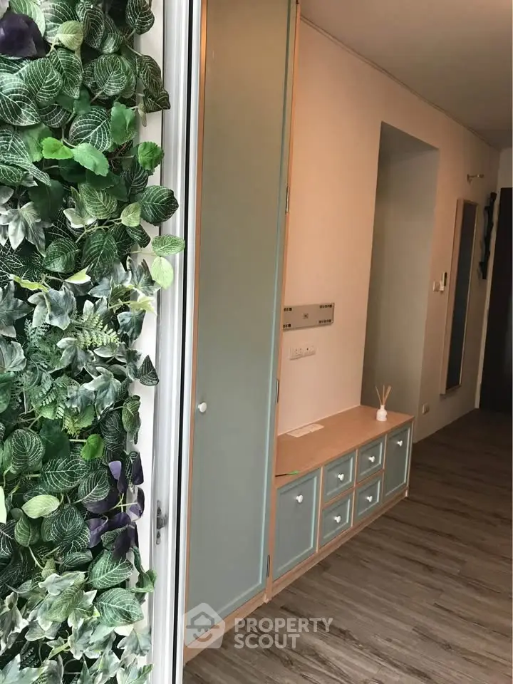 Stylish hallway with vertical garden and modern storage solutions