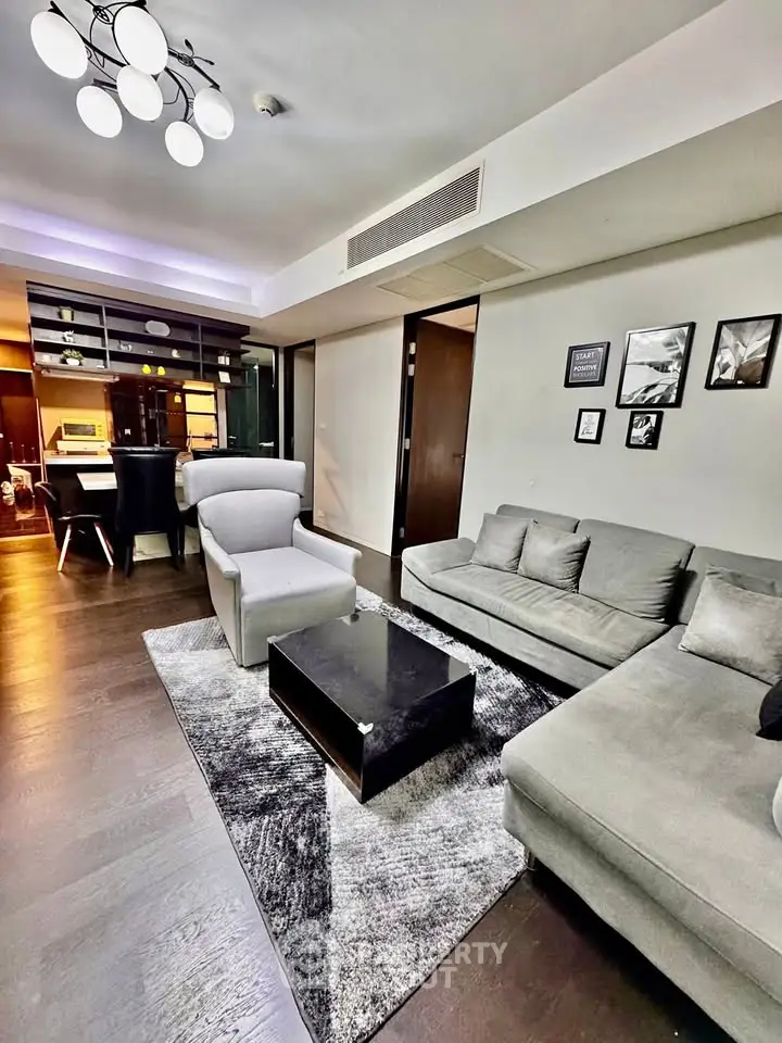 Modern living room with stylish furniture and open kitchen layout