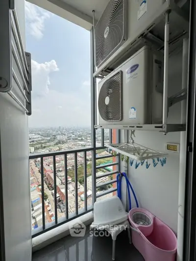 High-rise balcony with city view and air conditioning units, perfect for urban living.
