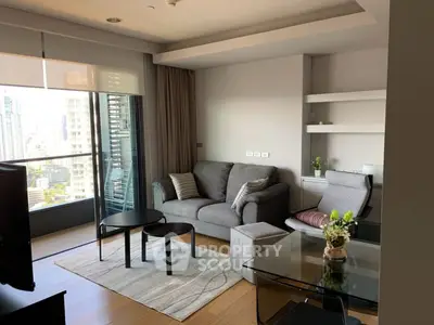 Modern living room with city view, stylish furniture, and natural light.